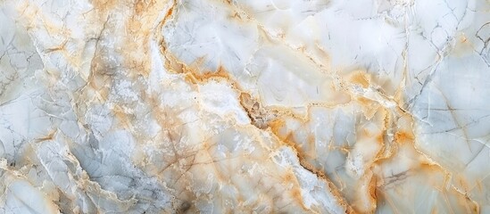 A detailed shot of a white and gold marble texture, resembling a luxurious and elegant surface. The pattern is reminiscent of natural material, with hints of rock and soil intertwined