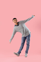 Young sailor on pink background