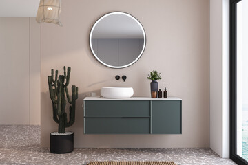 A bathroom with a green vanity and a mirror. A potted cactus is on the left side of the vanity