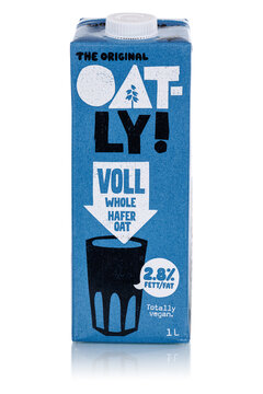 Oatly vegan oat milk whole oat flavor isolated on a white background portrait format
