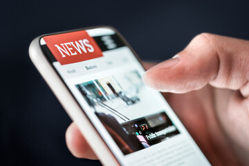 News in phone. Online newspaper article. Digital press publication. Reading latest headlines on...