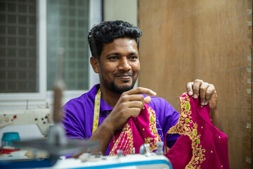 Close up Shot: Indian Tailor Working with Sewing Machine