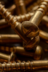 close up of many brass colored screws