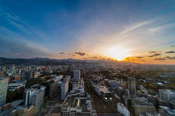 sunset or sun rise of Sapporo cityscape with Skyline and office building and downtown of sappiro is  populars ciy from toursim Hokkaido, Japan with twilight sky in spring season