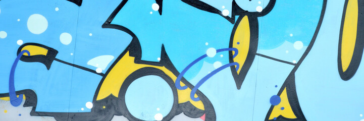 Colorful background of graffiti painting artwork with bright aerosol outlines on wall. Old school...