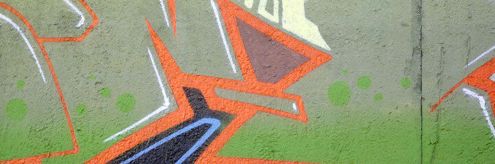 Colorful background of graffiti painting artwork with bright aerosol outlines on wall. Old school...