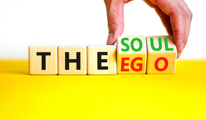 Soul or ego symbol. Concept word The soul or The ego on beautiful wooden cubes. Beautiful yellow...