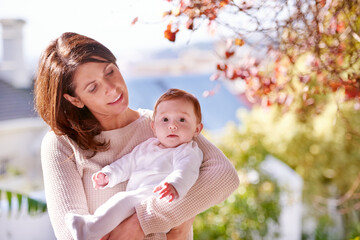 Woman, baby and portrait in nature for development, infant and childhood for cute and curious in summer. Mother, child or little girl in arms for bonding, fragile and junior for newborn and family