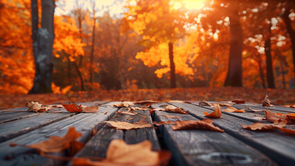 Naklejka na ściany i meble Enchanted Autumn: Wooden Table with Orange Leaves at Forest Sunset