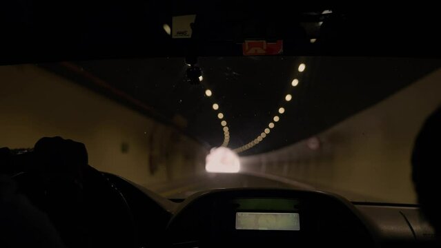 Car driving in a tunnel