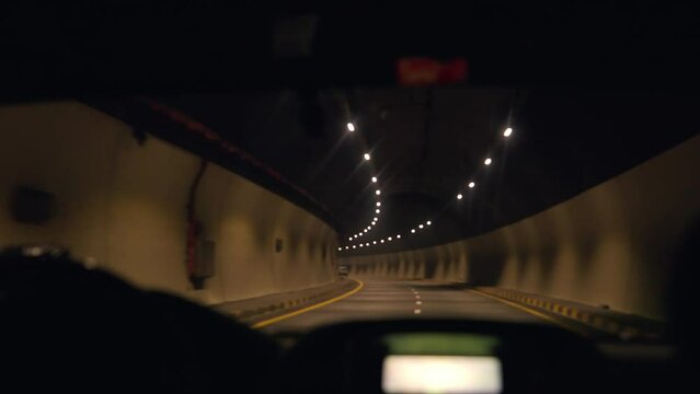 Car driving in a tunnel