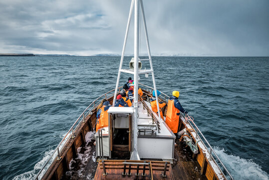 Fishers on the fishing boat in the sea of nordic country