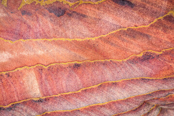 Texture of red rock stone. The Siq canyon