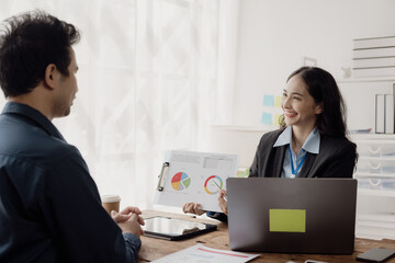 Obraz premium Successful people of various nationalities, creative business team presenting discuss ideas Brainstorm ideas, work as a team, have a meeting atmosphere with smiles at the conference room.