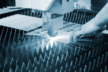 Metal laser cutting. Cutting sheet of metal by laser metal cutting. Industrial equipment machine...