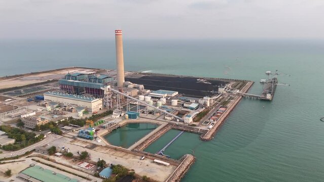 Heavy industrial coal power electricity plant with chimney and pipes, lignite coal product mass ready to be energy for electricity power plant