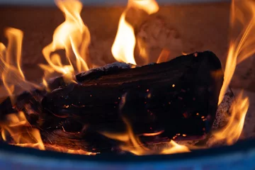Foto op Canvas 焚き火・薪を燃やす・キャンプ・暖炉イメージ © naka