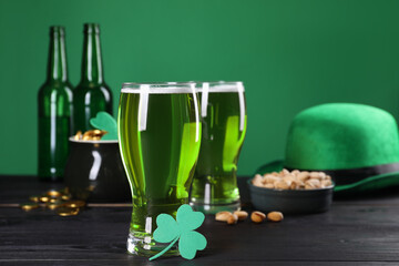 St. Patrick's day party. Green beer, leprechaun hat, pot of gold, pistachios and decorative clover...