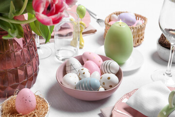 Festive table setting with painted eggs. Easter celebration