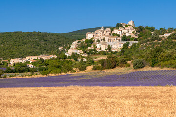 The Provence hilltop village of Simiane-la-Rotonde with lavender field in summer. Alpes-de-Hautes-Provence, France - 763331916