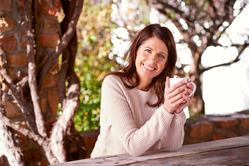 Morning, portrait and woman drinking coffee, espresso or cappuccino in backyard garden of home. Bokeh, smile and face of female person with hot beverage for relax, peace and happiness in nature