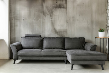 Gray corner sofa against concrete wall with copy space. by AI generated image