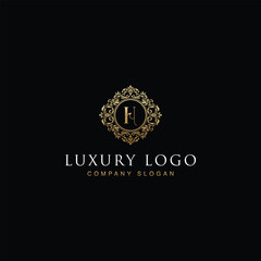 Luxurious elegant victorian floral filigree frame badge pattern with Initial letters H inside  circle badge emblem logo design vector in gold colors