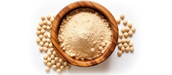 Wooden bowl filled with white beans beside a pile of beans