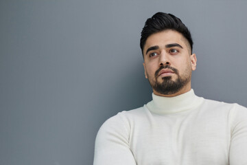 Obraz premium Portrait of stylish middle aged man posing on gray background