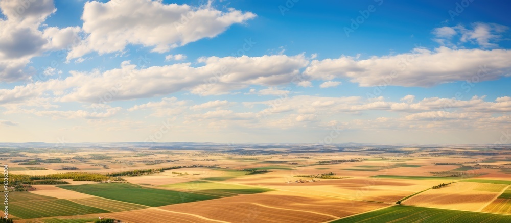 Poster aerial view of expansive farmland with scattered fields