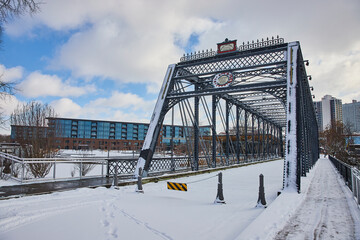 Winter Pedestrian Bridge with Modern City Backdrop, Fort Wayne