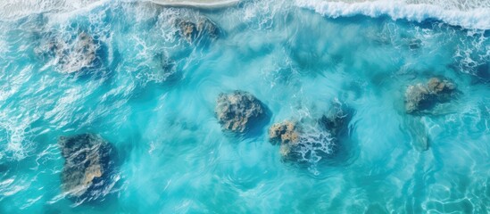 Aerial view of a rocky beach with crashing waves