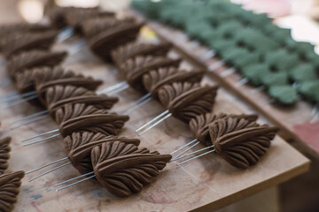 Clay leaves, pieces to make a traditional tree of life, typical Mexican crafts.