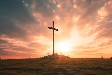 A cross is standing in a field with a beautiful sunset in the background. Concept of peace and serenity, as the cross stands tall and proud amidst the natural beauty of the landscape