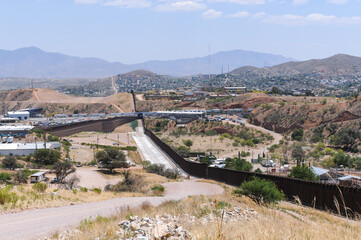 A panoramic view of the United States southern border with Mexico where the border wall and the...