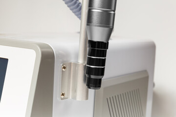 Close-up of a neodymium laser handpiece with an attachment for carbon peeling.