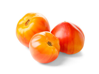 Yellow-red striped tomatoes on a white background.