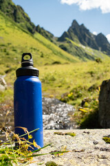  Eco-Friendly Water Bottle by a Mountain Stream - 763379301