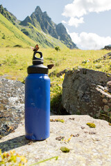  Eco-Friendly Blue Water Bottle Near Natural Stream with Butterfly - 763379323