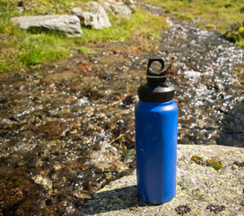  Eco-Friendly Blue Water Bottle Near Natural Stream with Butterfly - 763379335