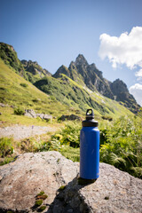 Sustainable Blue Water Bottle in Alpine Mountain Setting - 763379397