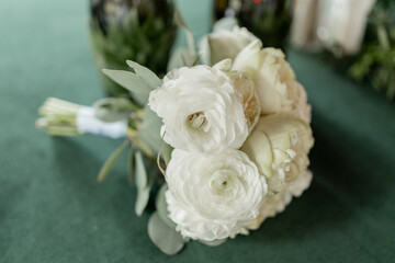 a wedding bouquet of beautiful flowers on the table in the room