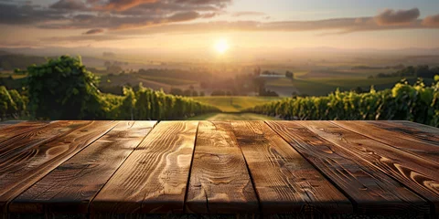 Fototapeten Wood table top on blurred vineyard landscape background © Ricardo Costa