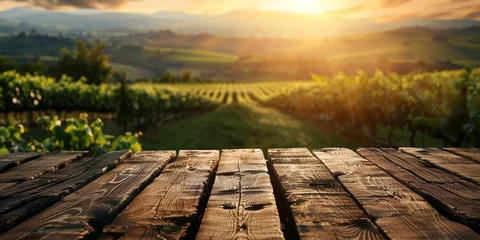 Fototapeten Wood table top on blurred vineyard landscape background © Ricardo Costa