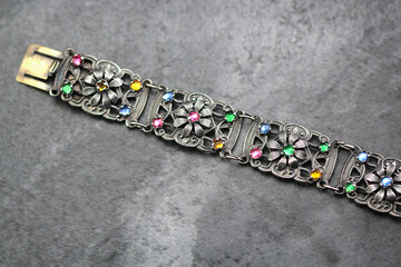 Antique 1920s Art Deco Filigree Floral Seven Panels Bracelet, Multicolor Glass Rhinestones, Silver...
