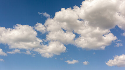 Naklejka na ściany i meble Cumulus white clouds. Aerial view to a dreamy sky
