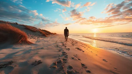 Rolgordijnen Serene Sunset Beach Walk - Solitary Man Enjoying Seaside Tranquility © Qstock