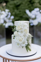 wedding cake near arch for the evening ceremony