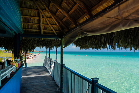 Pier of a hotel at Cayo Guillermo in the Jardines del Rey archipelago, with clear turquoise water and the horizon in the distance; Cayo Guillermo, Cuba