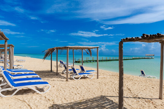 Chairs on a white sand beach in the Caribbean; Cayo Guillermo, Cuba